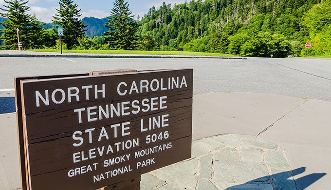 SM-Border-sign-Newfound-Gap_Adobe_680 Sign marking the state border on Newfound Gap road in Great Smoky Mountains National Park