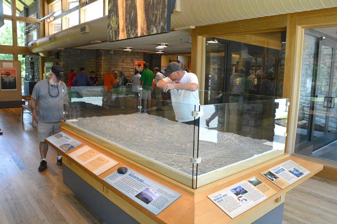 Oconaluftee-Visitor-Center_Gloria_680 Visitors look at the relief map of the national park at the Oconaluftee Visitor Center.